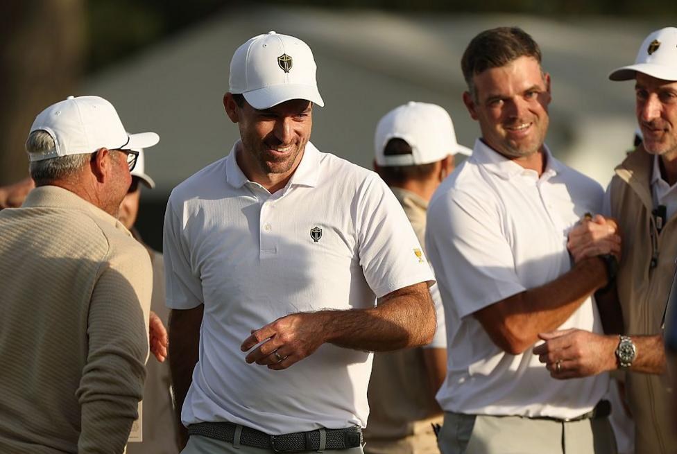 Canada's Corey Conners (centre) saved par on the 18th